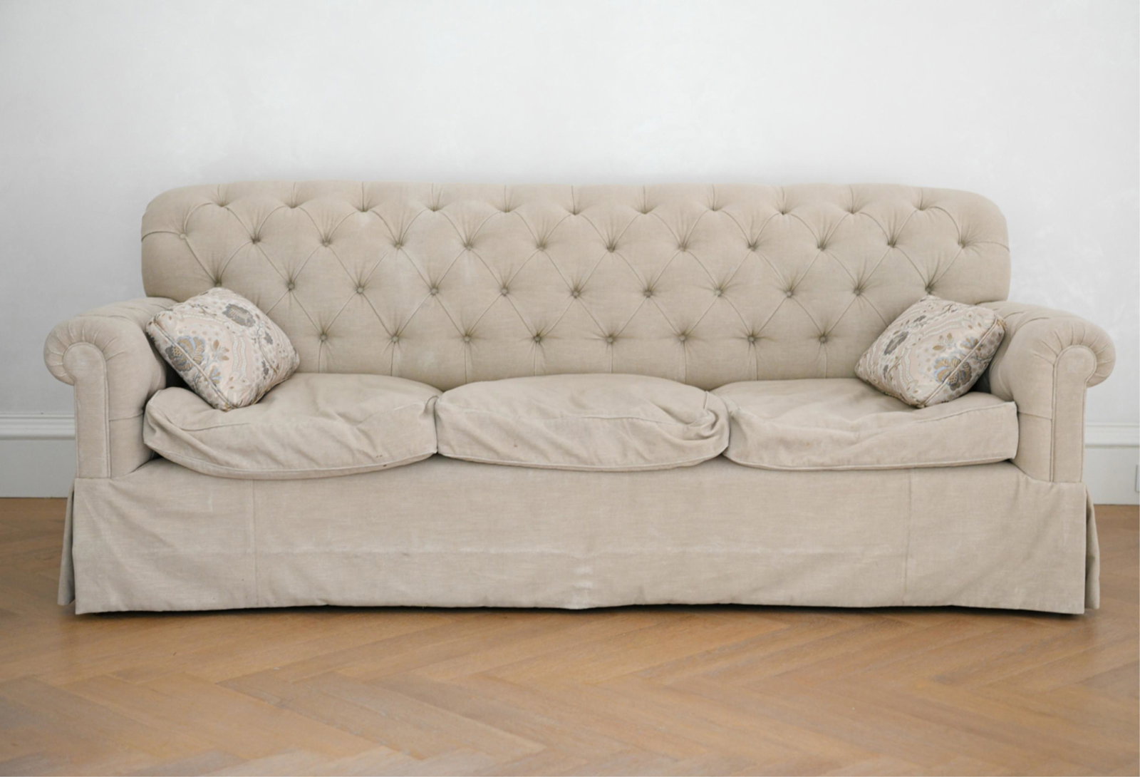 GEORGE SMITH BULGARI TUFTED SOFA: With rolled arms, tufted back. Label underneath cushion. Down-filled. Dimensions: H 34" x W 90.5" x D 41" x SH 17" Condition: Some soiling to fabric.