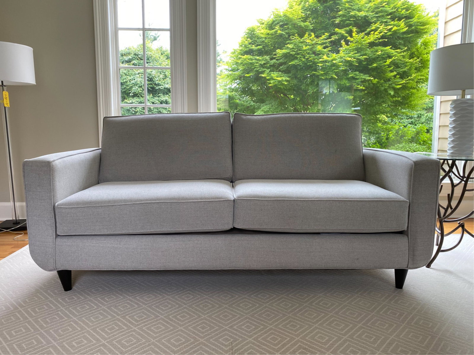 CONTEMPORARY LOVESEAT SOFA: Dimensions: H 30.5" x W 78.5" x D 37" x SH 20" Condition: Some wear to legs.