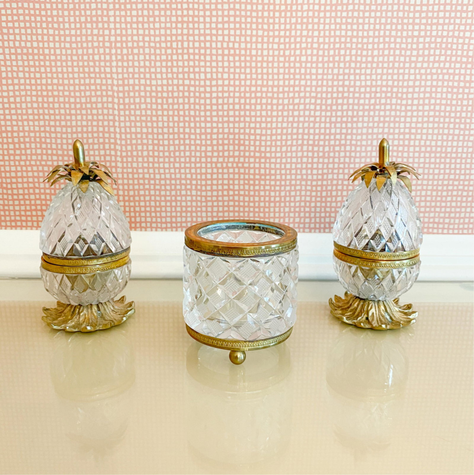 FRENCH CRYSTAL & ORMOLU GROUPING: (3) pieces. Including two pineapple boxes and a jar, all marked "made in France." Dimensions: (Box) H 5.25" x Dia. 2.5" Condition: Some small flea bites. Light tarnish.