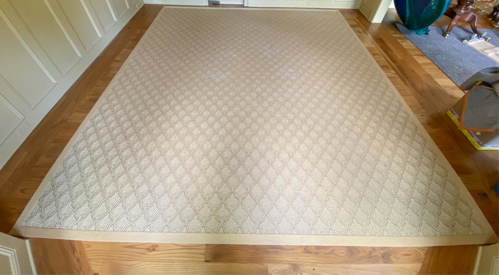 WOOL AND SISAL AREA RUG: Tagged Merida. Woven in Belgium, Bound in the USA.Dimensions: L 161" x W 143.5"Condition: Light wear from use. Some cracking to rug backing.