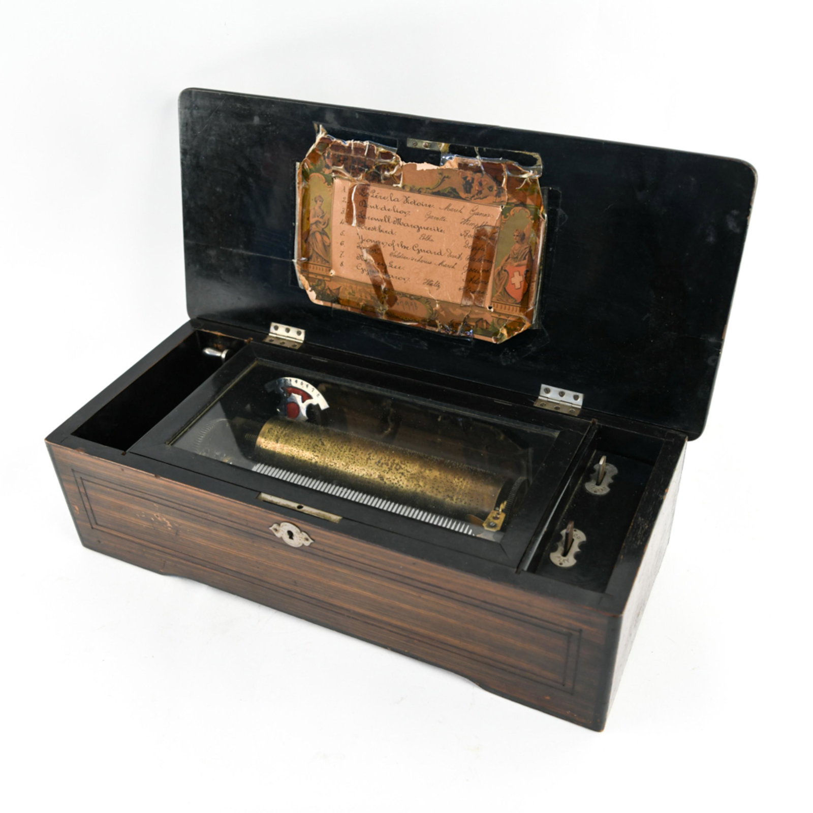 ANTIQUE SWISS CYLINDER MUSIC BOX: Dimensions: H 5.75" x W 18.5" x D 8.25" Condition: Functional. No key. Wear consistent with age and use including scratches and losses. Splits to wood at back of box.