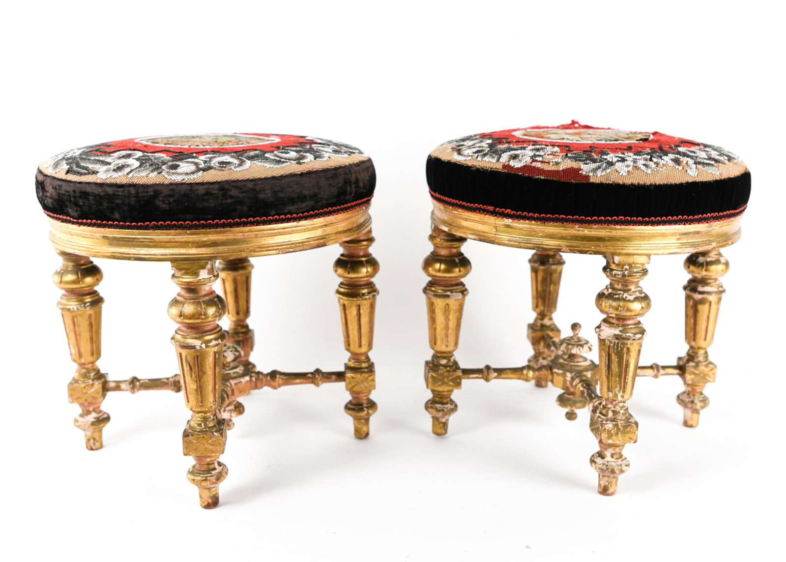 PAIR OF 19TH C. ENGLISH GILT WOOD STOOLS: With beaded and petit point upholstery. Dimensions: H 15" x Dia. 15.5" Condition: Gilding with losses, upholstery with pulls and tears.