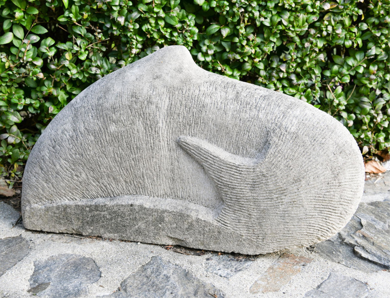 NATE ATWATER ABSTRACT CARVED STONE WHALE SCULPTURE: Carved of limestone, apparently unsigned. Dimensions: H 15" x W 26" x D 8" Condition: Signs of outdoor wear.