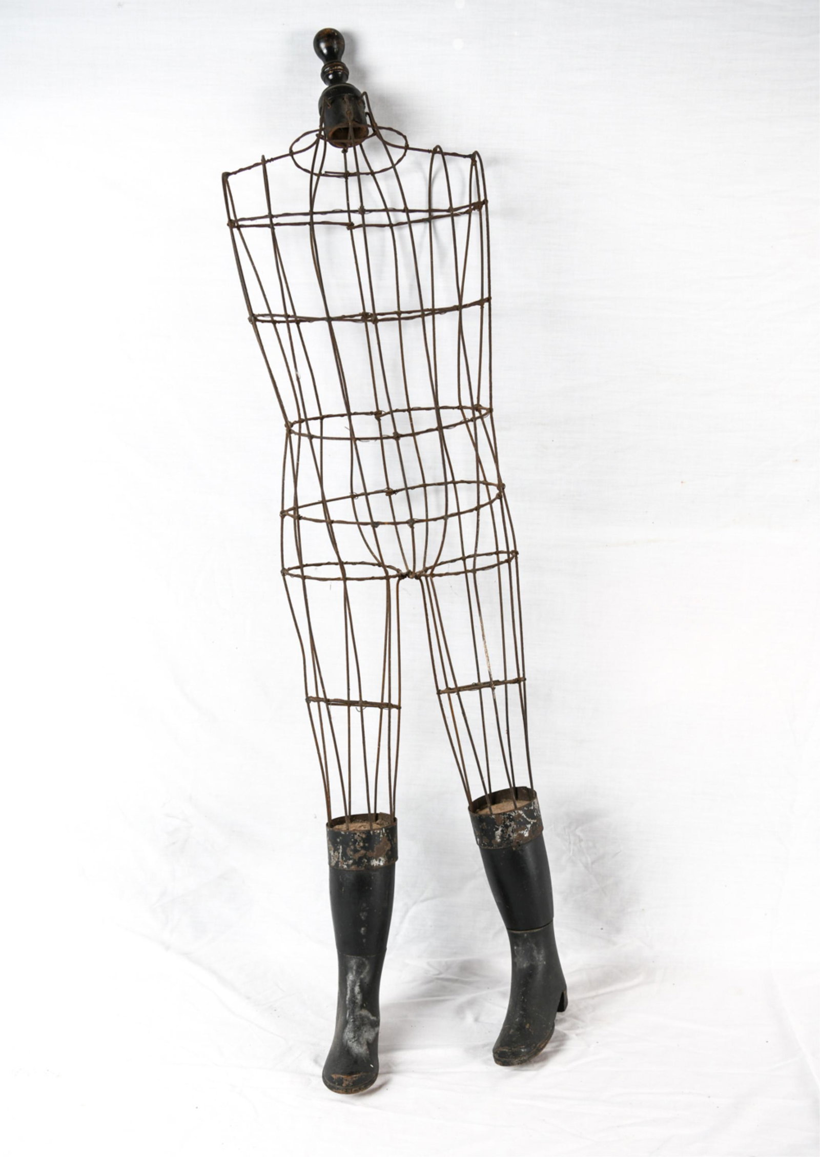 CHILDS WIRE MANEQUIN LEG W/ BOOTS FORM: Dimensions: H 41" x W 12" x D 7" Condition: Missing heel on one foot. Rubbing to wood and scuffing to metal.