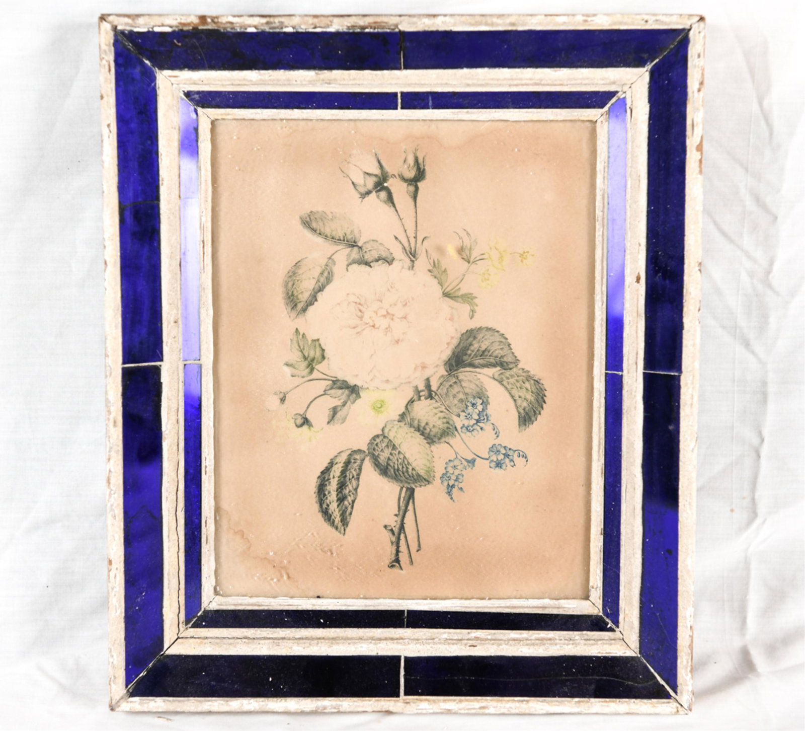 ANTIQUE COBALT MIRROR GLASS FRAME: Dimensions: (Frame) H 14.5" x W 12.5" (Sight) H 10.5" x W 8.25" Condition: Showing signs of age including distressed frame and yellowing to paper.