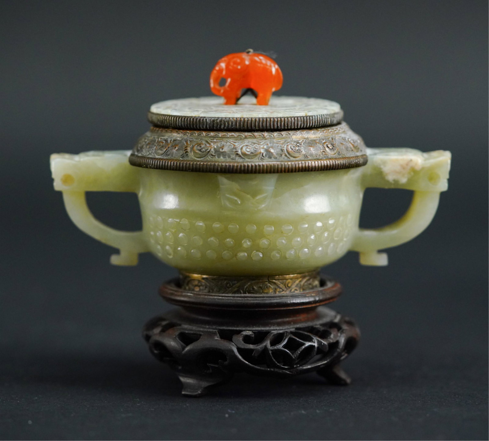 1920'S MOUNTED CHINESE CARVED JADE: Bronze mounted jade and carnelian. Dimensions: H 4.5" x W 5" x D 3.25" Condition: Only very minor chips to edges to top, wooden base with repairs.