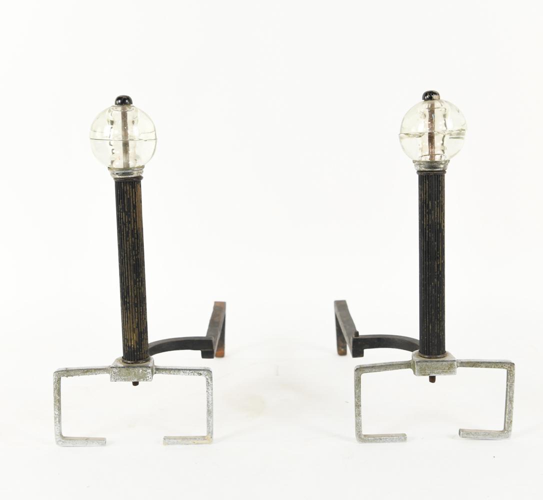 ART DECO ANDIRONS: USA 1920s. Chromed and enameled steel. Unsigned. Dimensions: H 15" x W 8" x D 14" Condition: oxidation throughout.