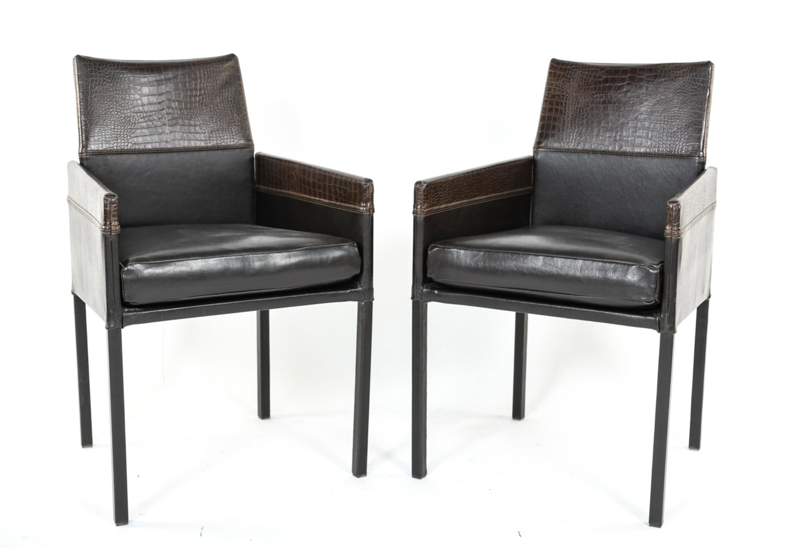 MARIO BELLINI STYLE "DIRECTOR" ARMCHAIRS: Pair of Italian 1990s embossed and stitched leather armchairs. Unsigned. Dimensions: H 33.5" x W 21.5" x D 19.5" SH 20.8" Condition: Minor scuffs and scratches. Sturdy and comfortable. Overall good co