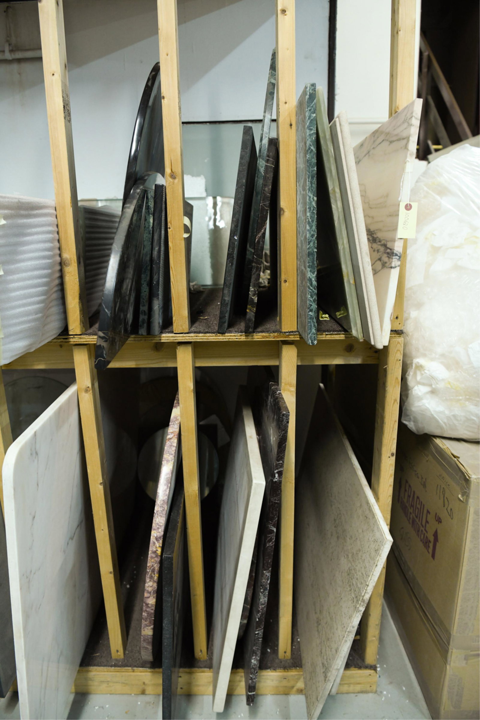 ASSORTMENT OF MARBLE AND STONE TOPS: Types, thickness, and sizes vary. Dimensions: Various dimensions. Condition: Consistent with age and storage. Buyer must take all pieces.