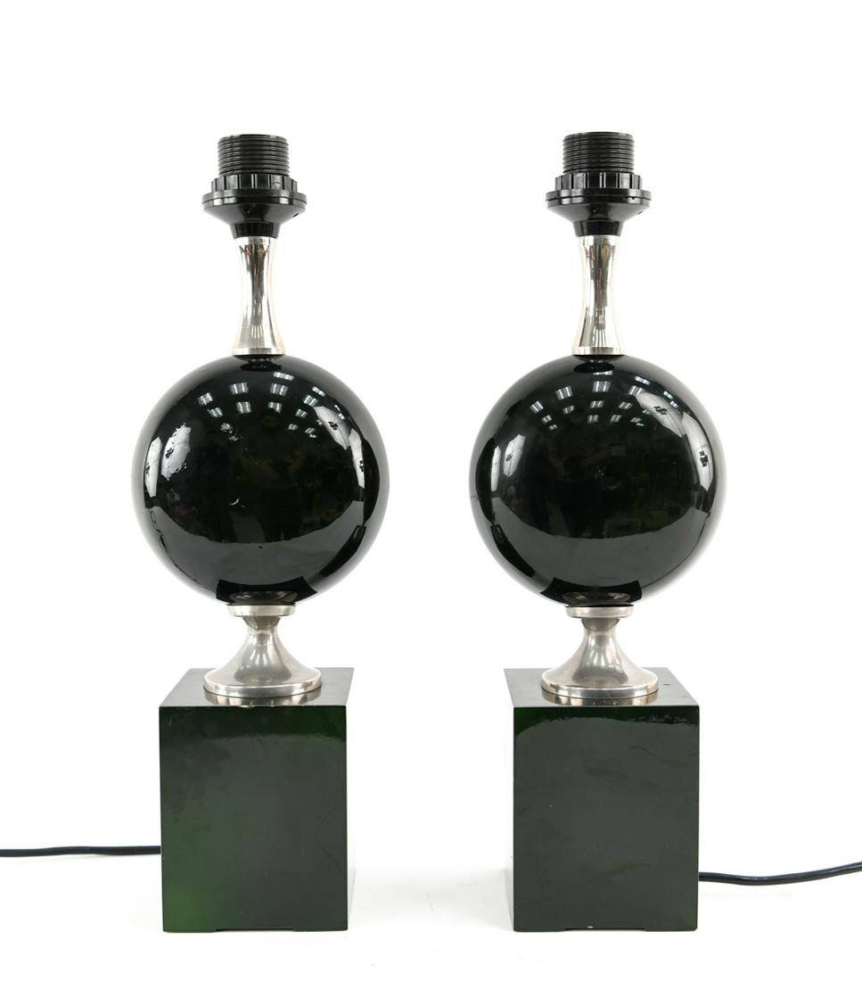 PAIR OF FRENCH MAISON BARBIER GREEN ENAMELED LAMPS: Dark green in color, enameled steel. France, 1960's. Dimensions: H 17" x W & D 3.75" Condition: Chip with repair, dings and scratches. European wiring.