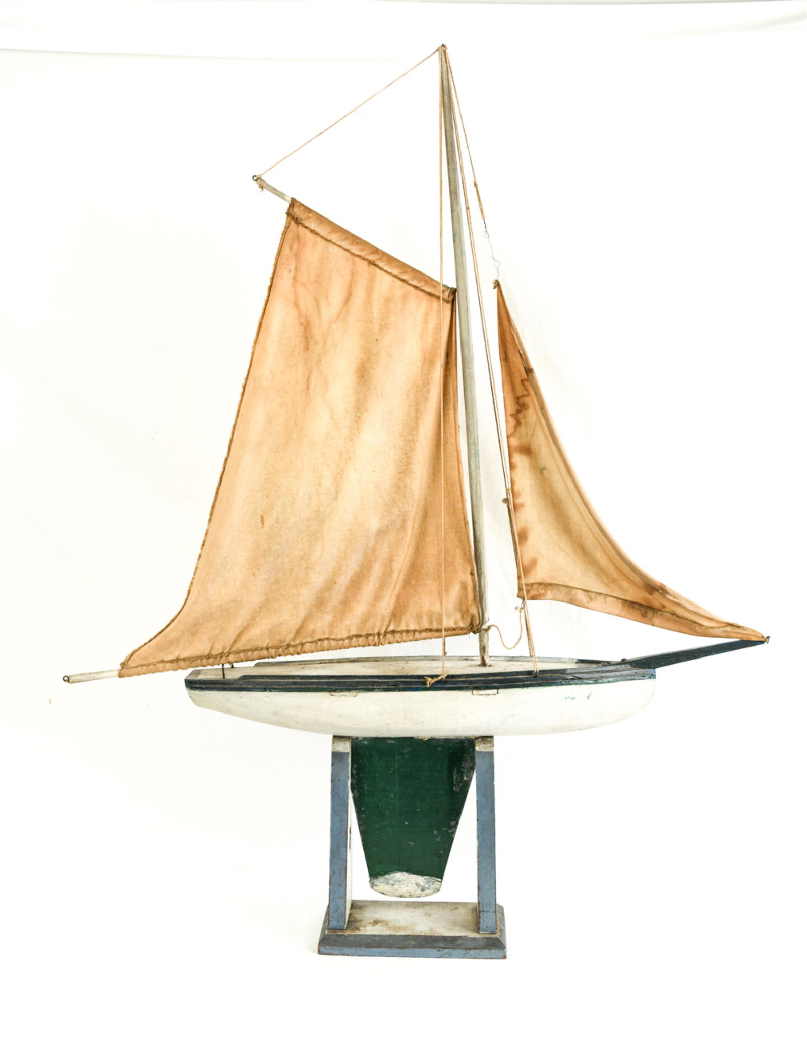 VINTAGE POND BOAT: Dimensions: (On stand) H 44" x W 34" x D 6.5" Condition: Some soiling to the sails. Paint wear and flaking. Overall surface wear consistent with age and use.