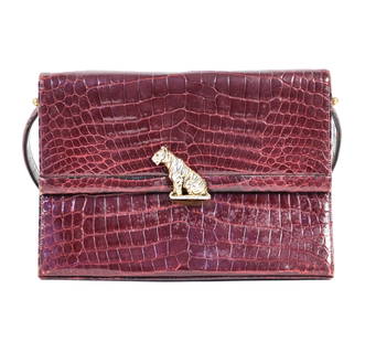 MARTIN VAN SCHAAK ALLIGATOR BAG: With brass plated tiger buckle. Dimensions: (Incl. handle) H 13" x W 10.25" x D 3.25" Condition: Loss to plating on buckle. Normal edge scuffs and scrapes to alligator. Signs of use to interior includ