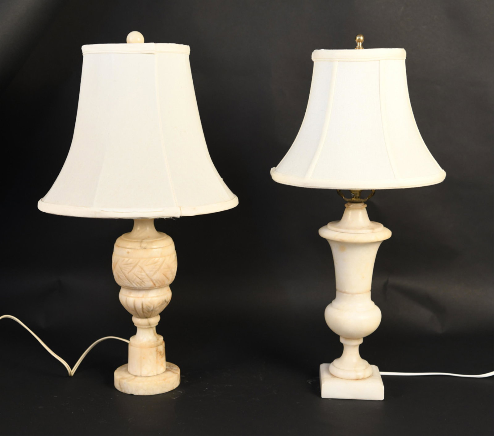 (2) MARBLE LAMPS: Marble or alabaster. Dimensions: (Largest top of finial) H 22" x Dia. 12" Condition: Untested. Wear consistent with age and use including nicks and chips to marble. Patina to metal hardware. Tears and