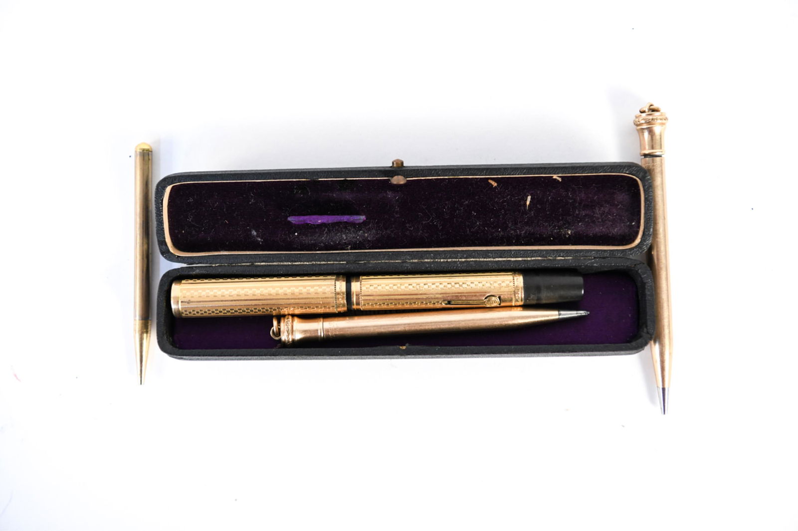 GROUPING OF GOLD FILLED PENS & PENCILS: Including a Waterman Ideal fountain pen with gold nib and original box, two Wahl Intersharp mechanical pencils, etc. Dimensions: (Waterman) L 5.25" Condition: All showing signs of age. Minor loss to p