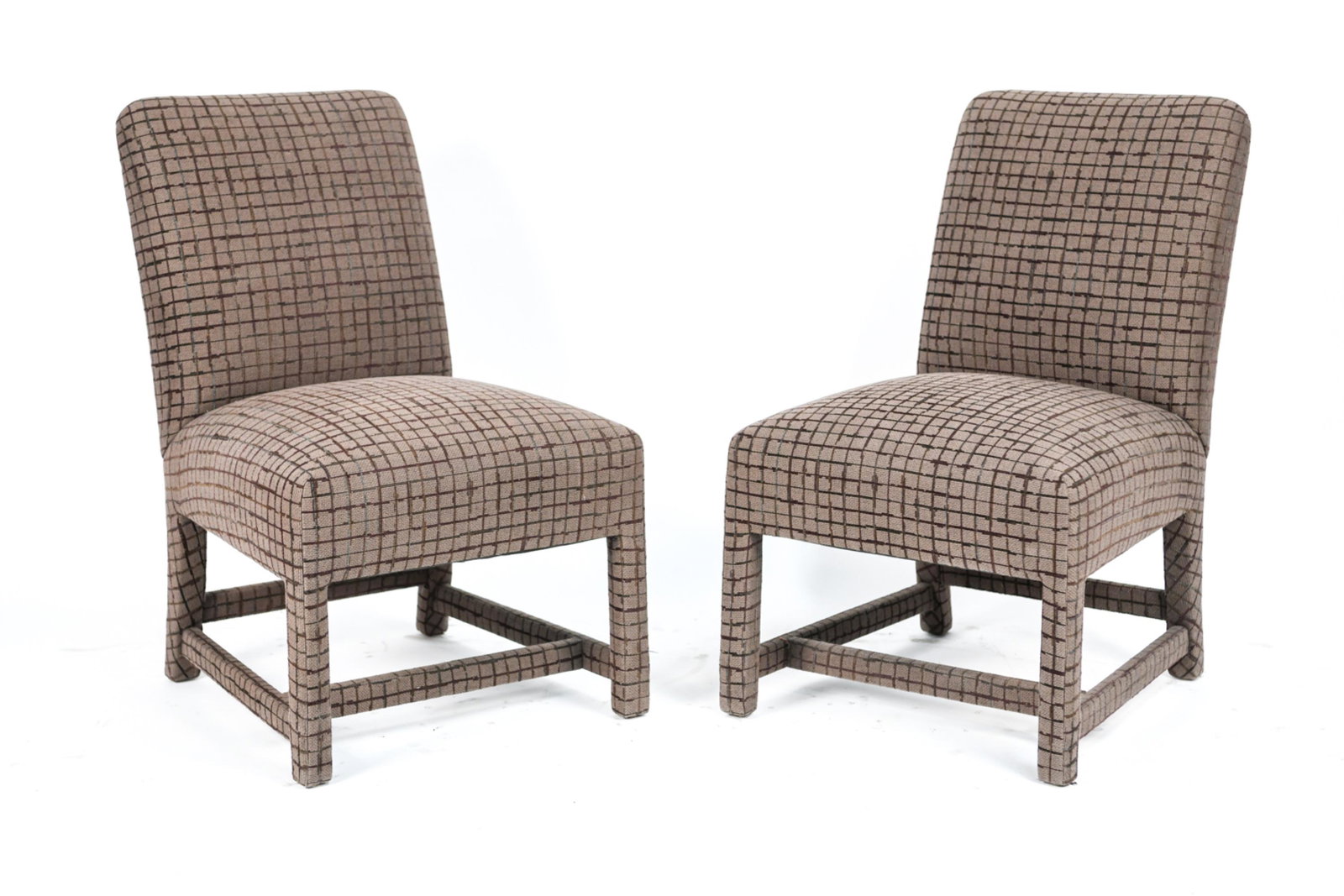 PAIR OF DONGHIA MADISON SIDE CHAIRS: A masterwork of minimalist perfection. The fully-upholstered dining chair has a tight back and seat which gives the Madison, a bold tailored look. Marked underneath. Dimensions: H 34" x W 21" x D 22" 
