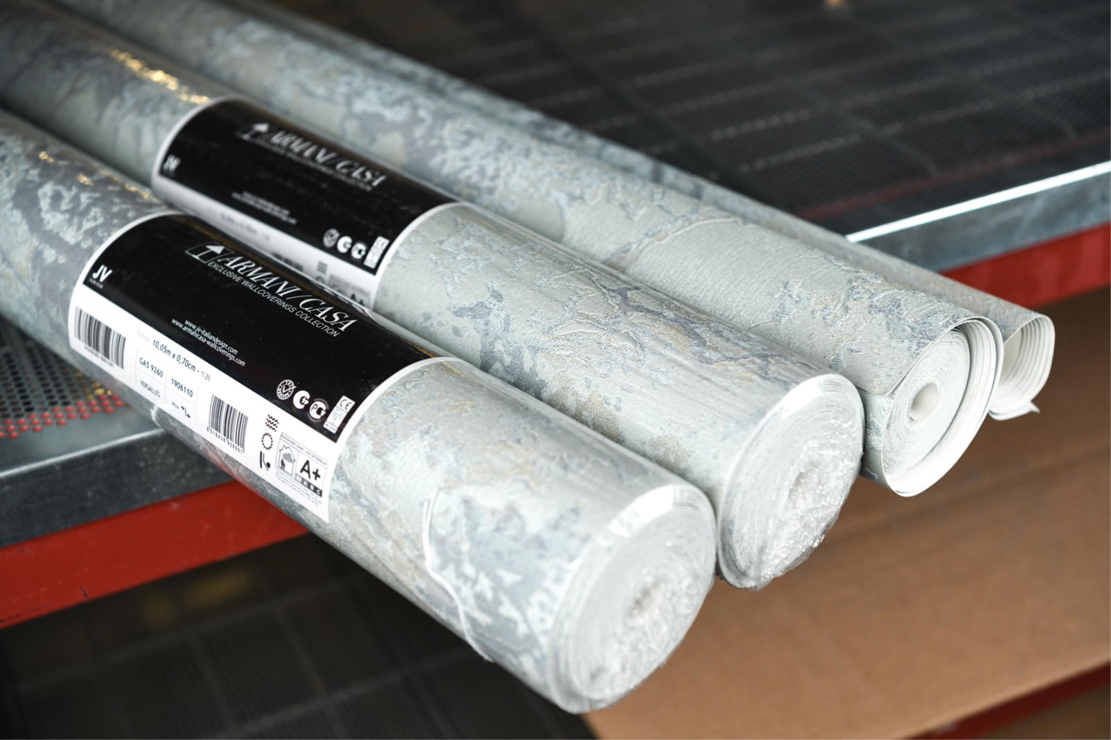 JV ARMANI CASA WALLPAPER GA5 9260 "VERSAILLES": (2) in package, (2) out of package partial rolls. Dimensions: (New) H 27.5" x W 11 yards Condition: Two in packaging, two opened and partially used.