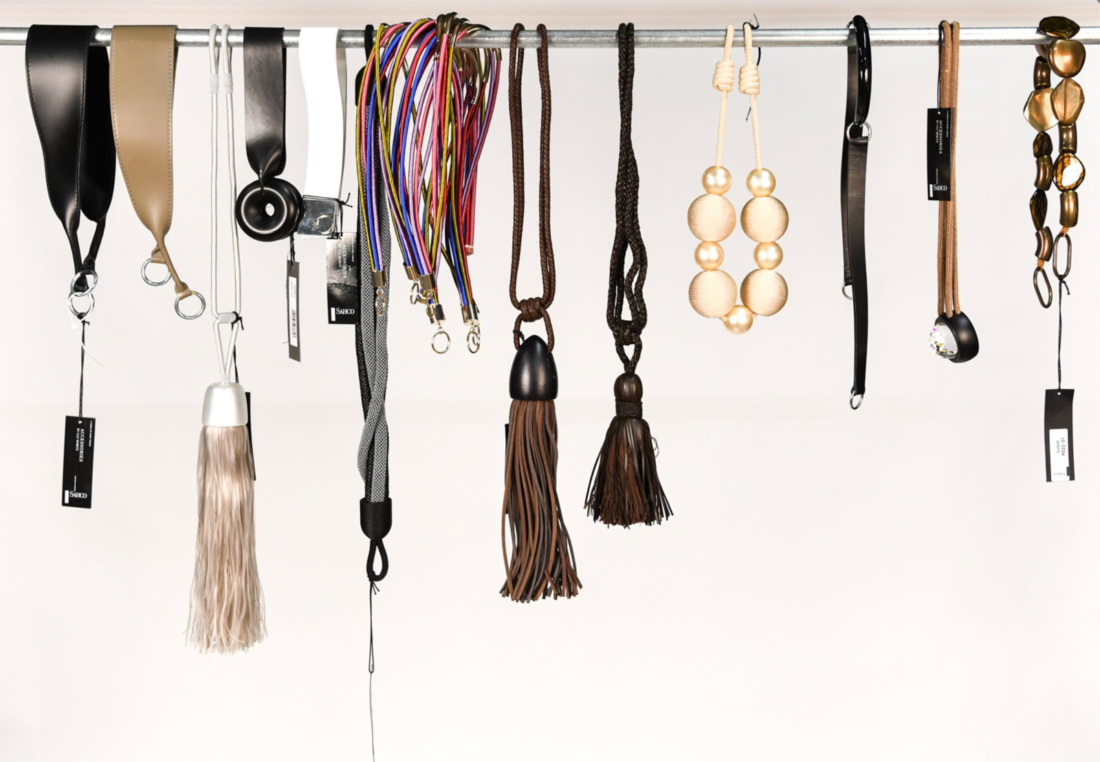 GROUPING OF ULF MORITZ FOR SAHCO CURTAIN TIEBACKS: Various styles. Dimensions: (Brown leather) L 27" Condition: Some handling wear. Some new with tags.