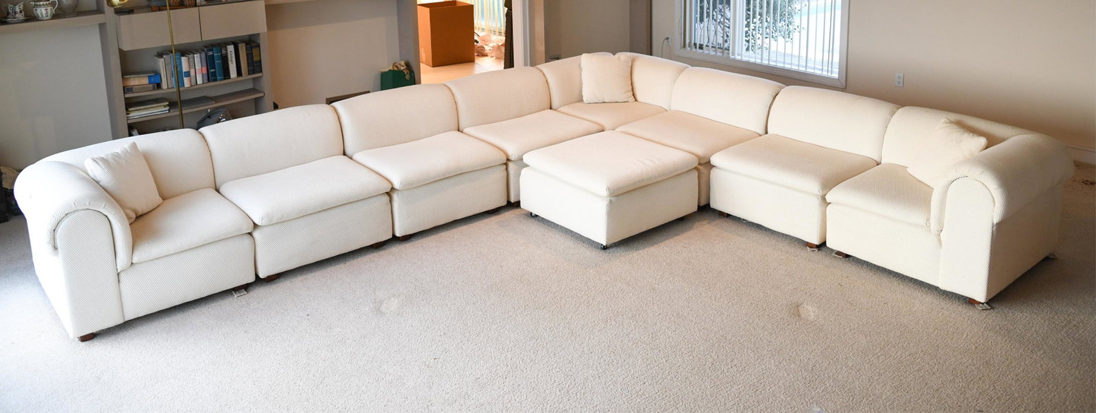 SELIG SECTIONAL SOFA: Selig modular group sectional sofa attributed to Pierre Cardin. Original upholstery Selig # 304 in bone color. Dimensions: (As shown) H 27" x W 158" x D 135" x SH 16" Condition: Needs a cleaning or po