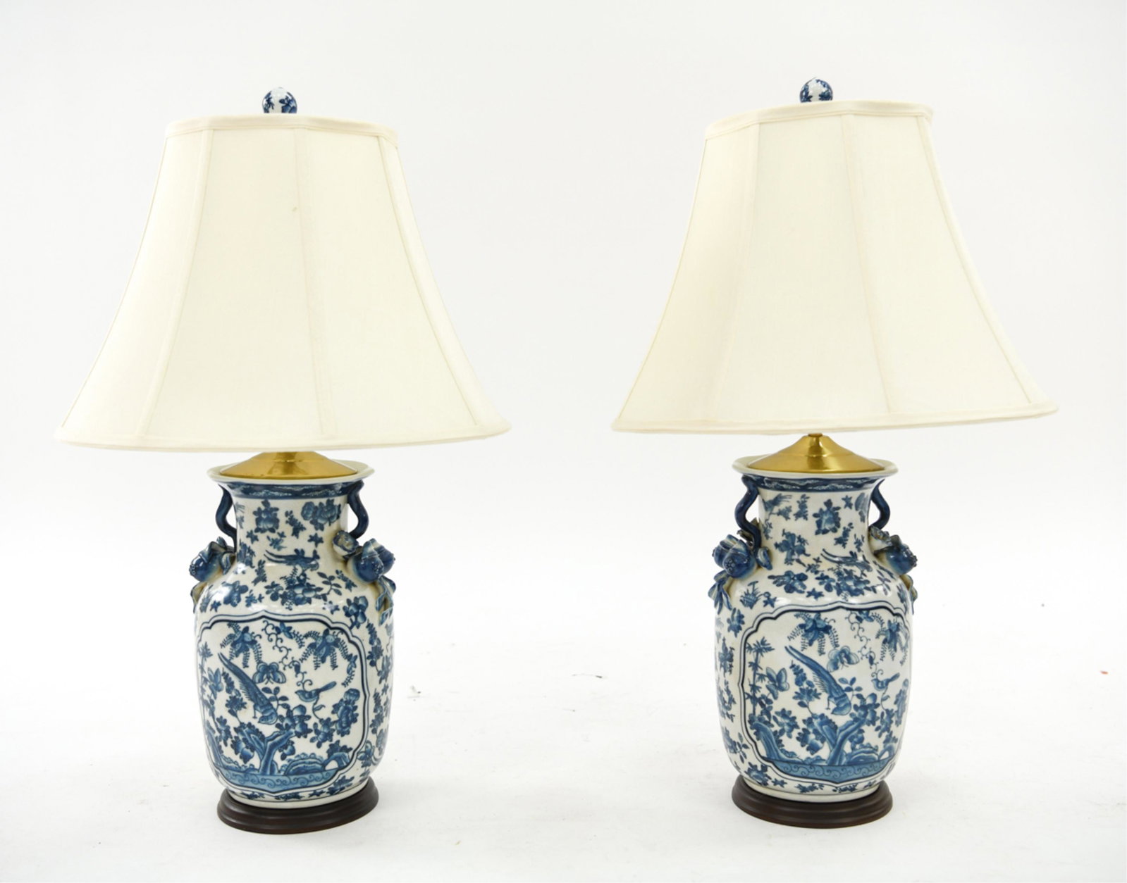 PAIR BLUE AND WHITE CHINESE VASE LAMPS: Contemporary. Dimensions: H 31" x Dia: 11" Condition: Showing minor signs of use and age.
