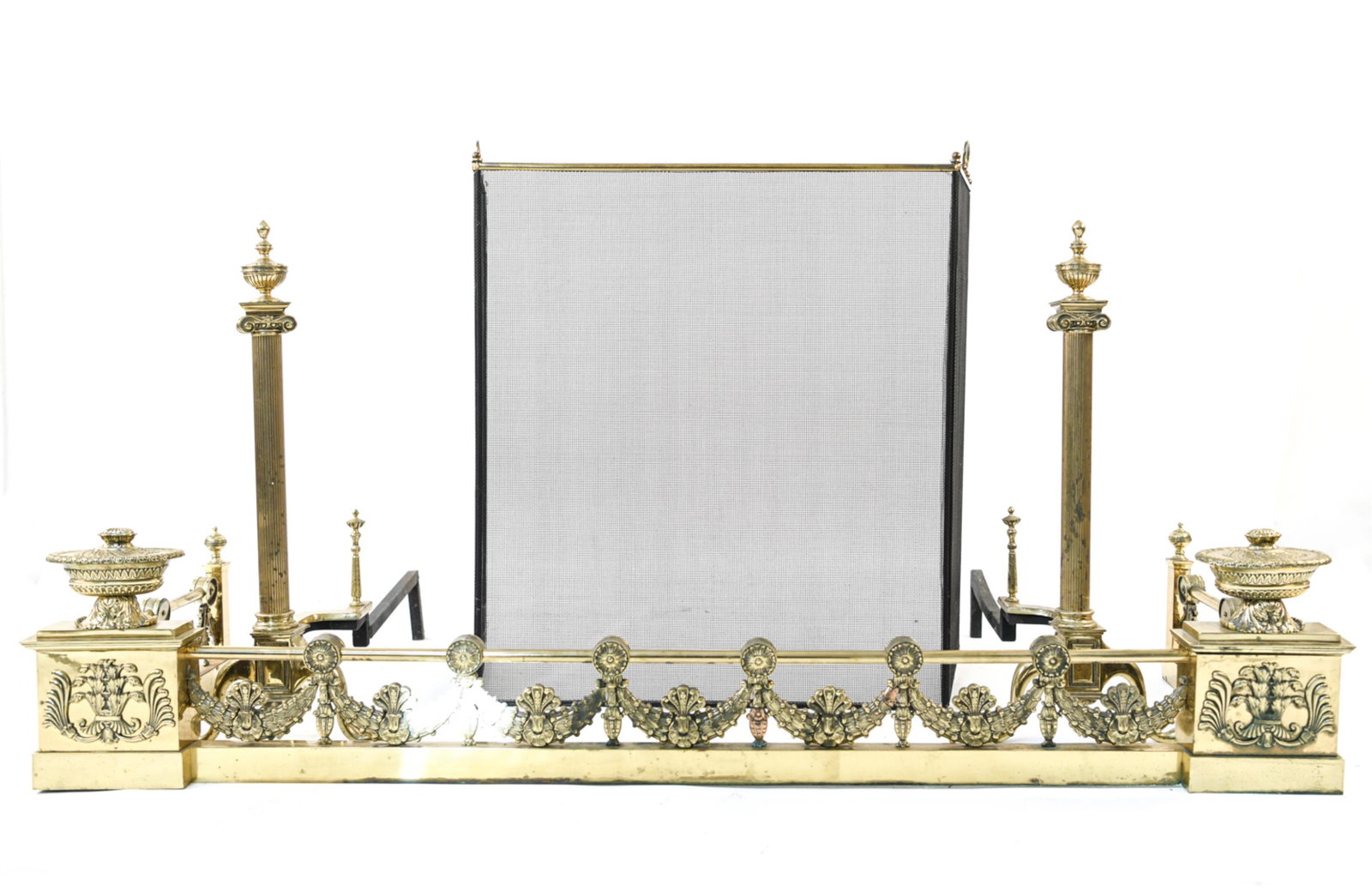 FIRE SCREEN, FIRE FENDER AND ANDIRONS GROUP: Including (1) Screen, (1) Fire Fender and (2) Andirons. Dimensions: (Fender) H 12" x W 60" x D 21" Condition: Wear consistent with fireplace use including scratches, nicks and oxidation to surfaces wi