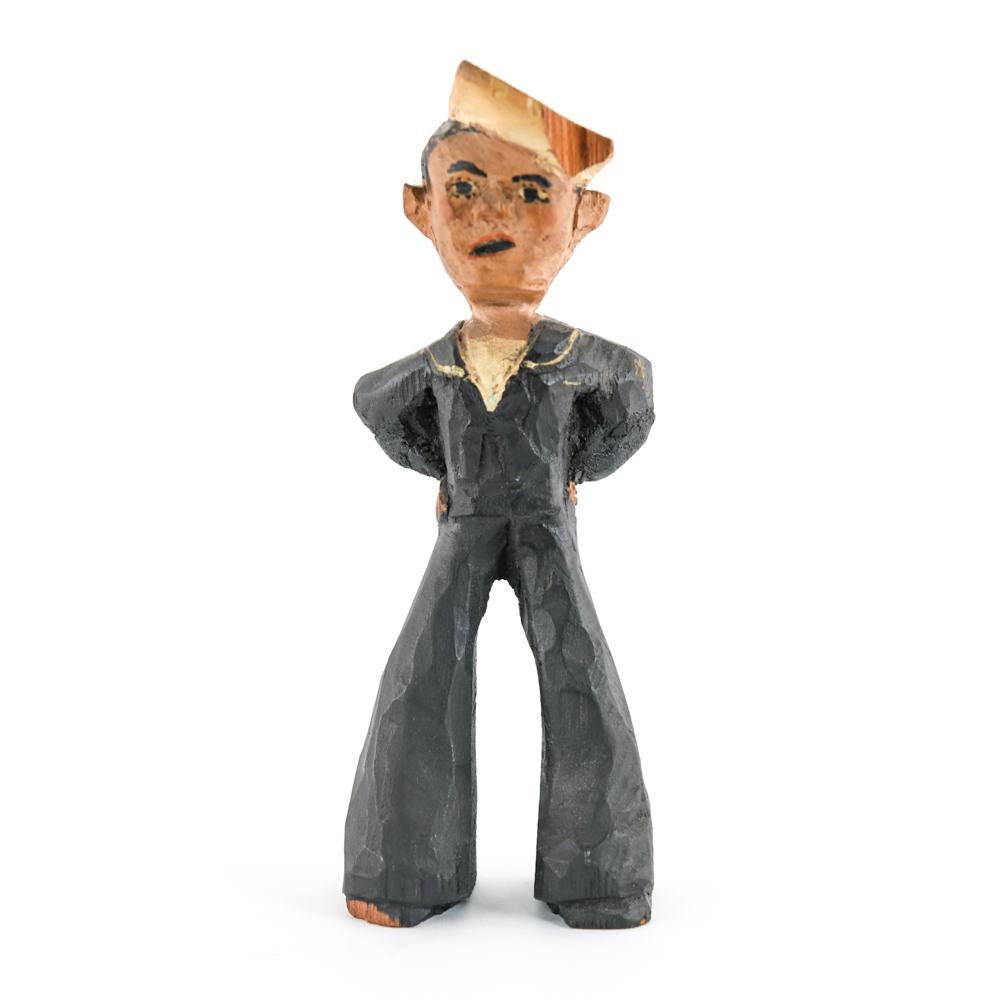 CARVED FOLK ART WOODEN SAILOR: Unsigned. Dimensions: H 10.5" x W 3.75" x D 2.75" Condition: Some small chips to wood, paint wear.