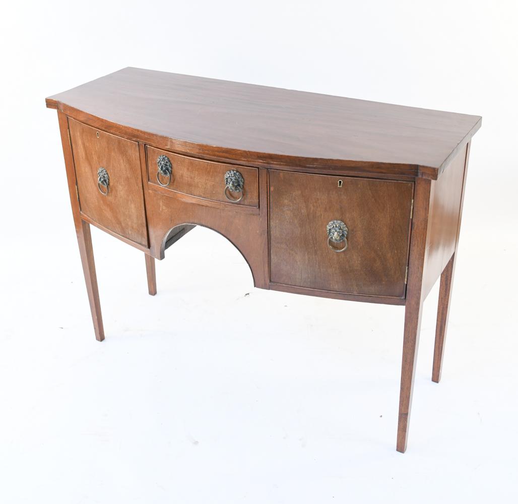 ENGLISH STYLE MAHOGANY SERVER: With key. Including lion head pulls. Dimensions: H 36.5" x W 49" x D 22" Condition: Wear consistent with age and use including surface scratches, nicks and scuffs.