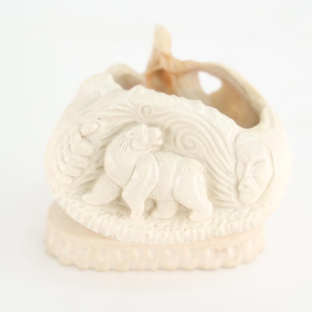 J. LEE ALASKAN WHALE BONE CARVING: Marked on bottom. Dimensions: H 3.5" x W 4" x D 3" Condition: No issues to note.