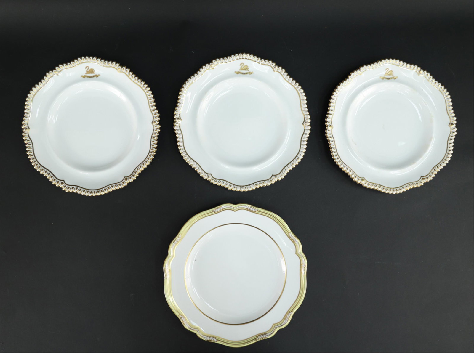 (4) GOLD RIMMED PORCELAIN DINNER PLATES: One made by Spode, three made by T.Goond & co. Dimensions: (Largest) H 10.5" x W 10.5" x D 1" Condition: Some staining to glaze. Slight signs of rubbing to gold rim.