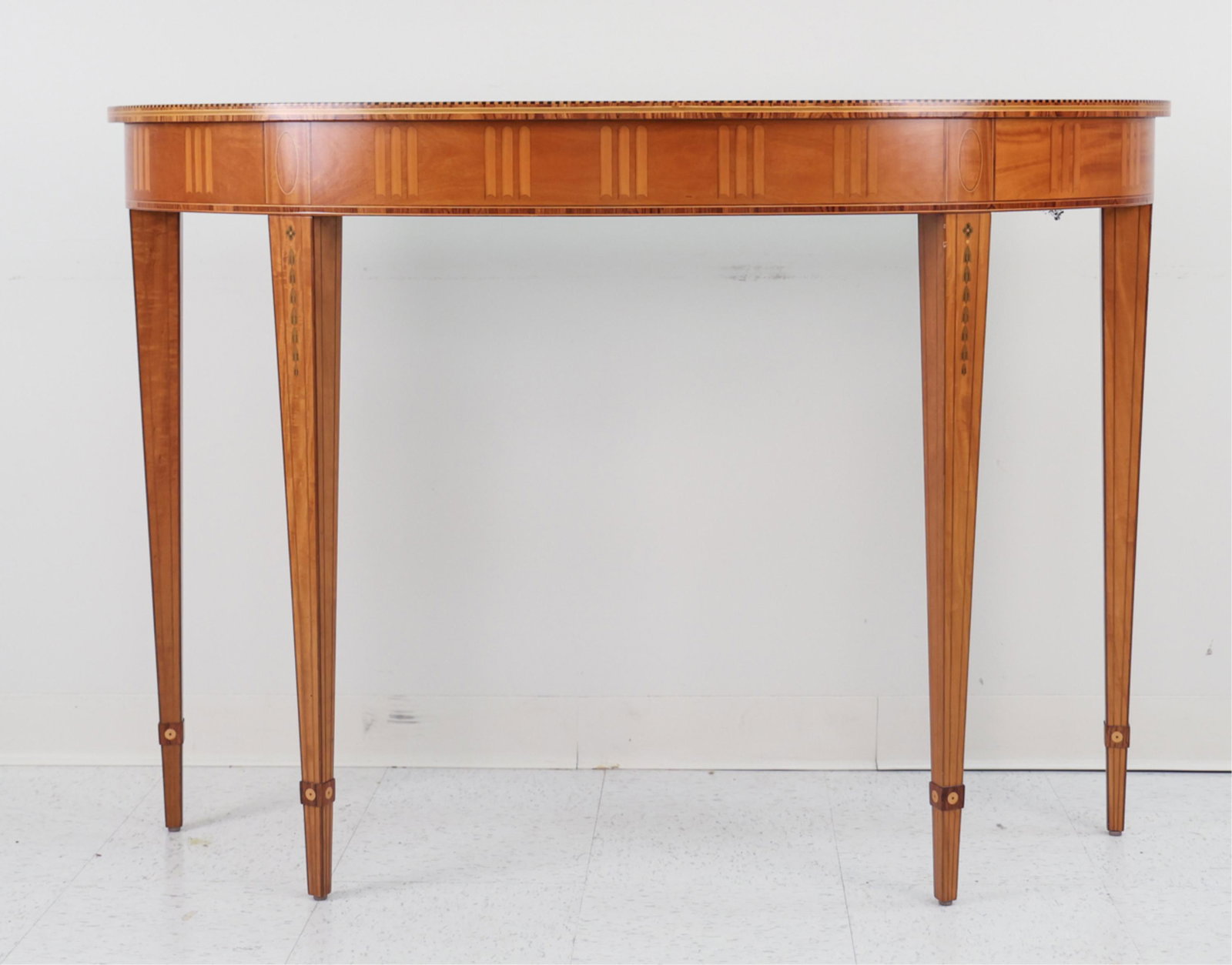 DEMI-LUNE CONSOLE TABLE: Marked Irish Georgian Society Reproductions on verso. Dimensions: H 36.5" x W 52"x D 17.75" Condition: Couple light marks.