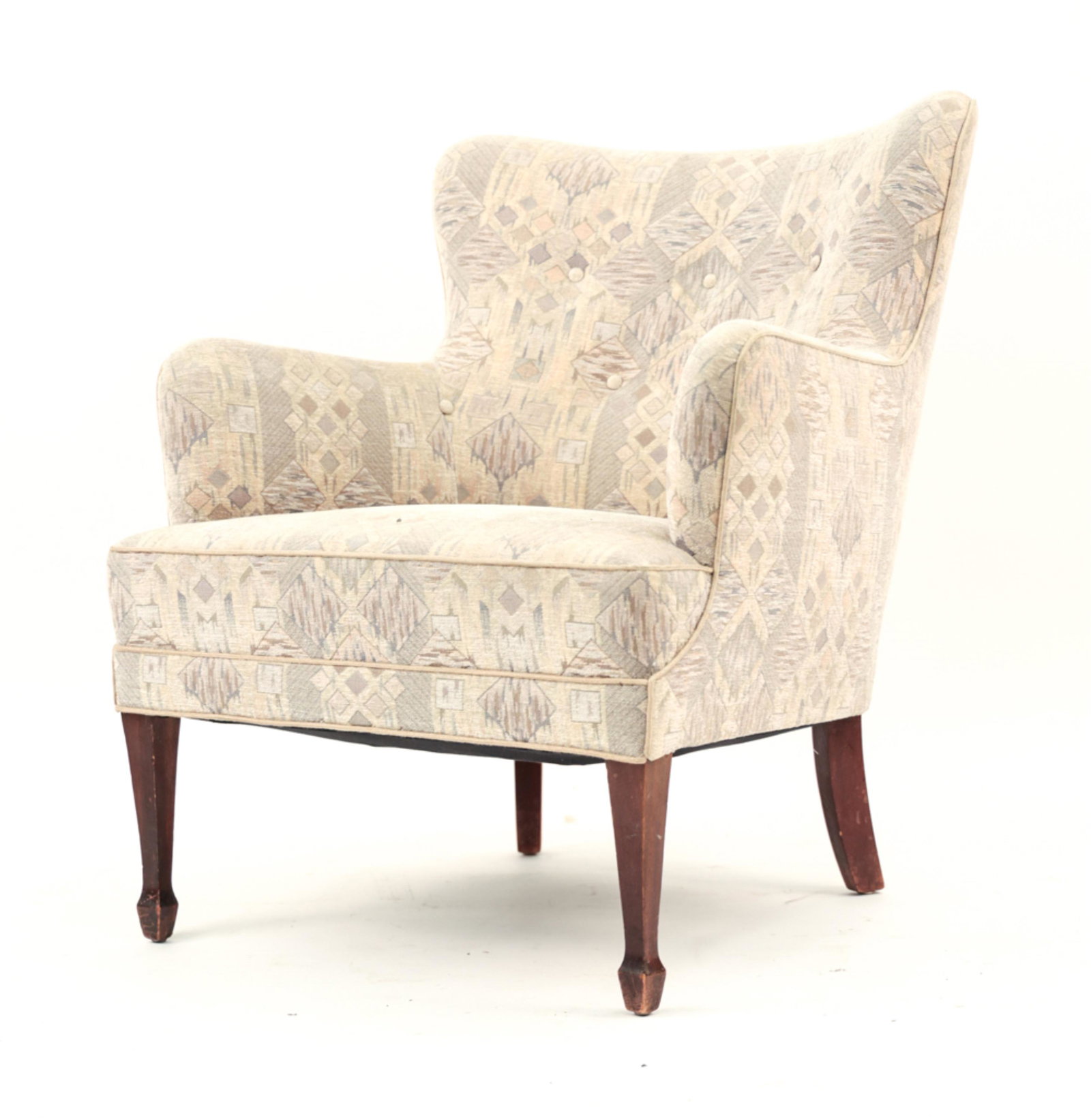 FRITS HENNINGSEN LOUNGE CHAIR: Mahogany front legs with patterned upholstery. Dimensions: H 31" x W 26" x D 28" x SH 15" Condition: Showing normal signs of use consistent with age. Few marks to wood.