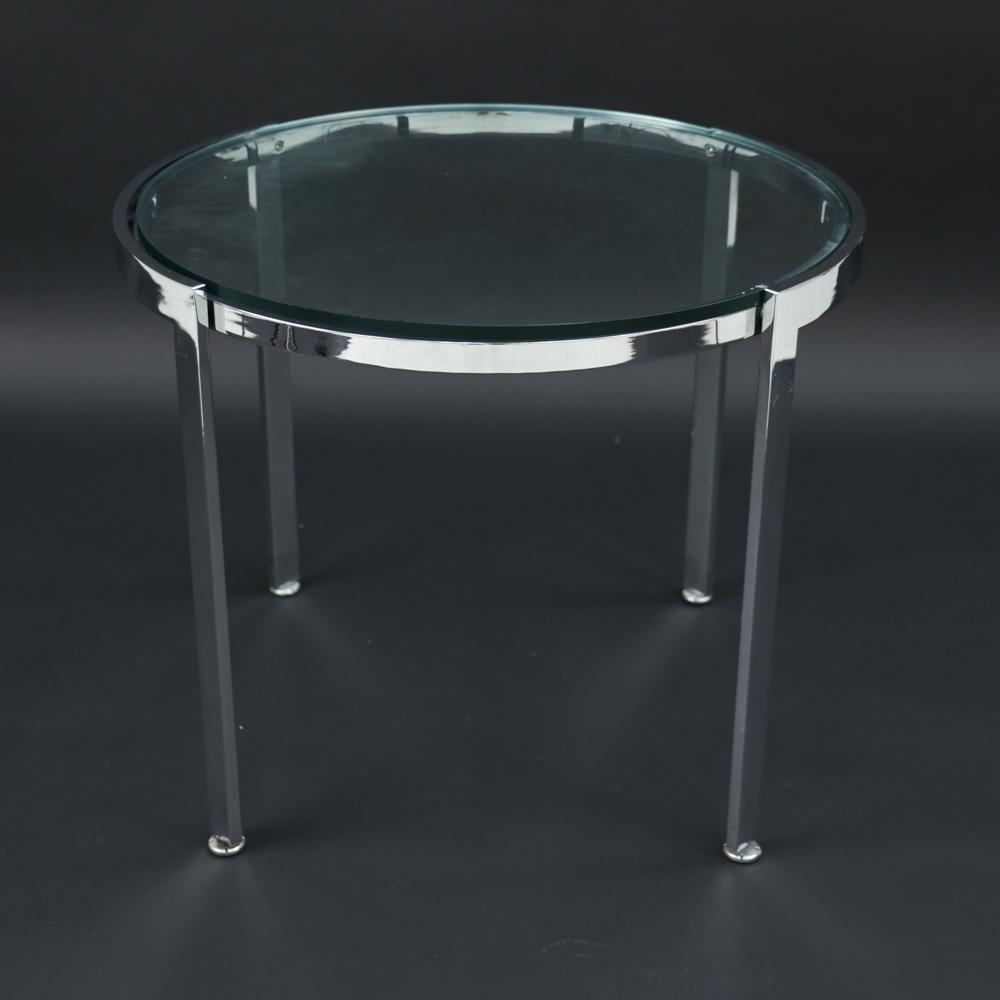 GEIGER CHROME AND GLASS SIDE TABLE: Dimensions: H 20.5" x Dia. 25" Condition: Minor signs of use.