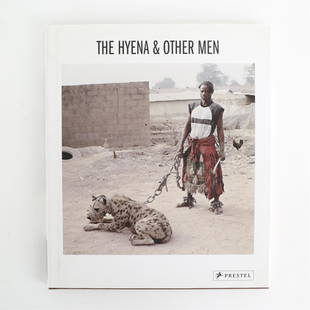 BOOK THE HYENA & OTHER MEN: The Hyena & Orher Men by Pieter Hugo published in 2007. Dimensions: H 11.5" x W 9.75" x D .5" Condition: Used.