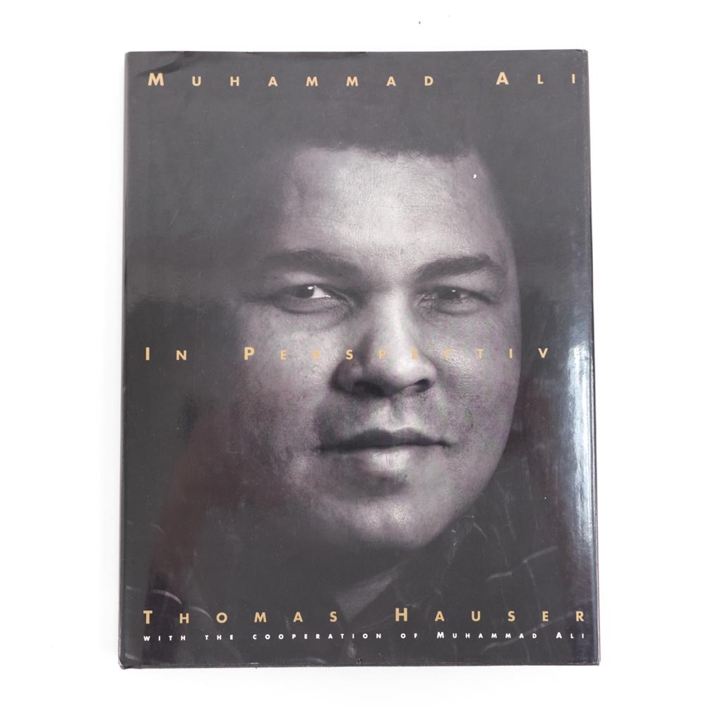 MUHAMMED ALI AUTOGRAPHED BOOK: Signed to inner cover. Dimensions: H 12.25" x W 9.5" x D .75" Condition: Normal signs of use.
