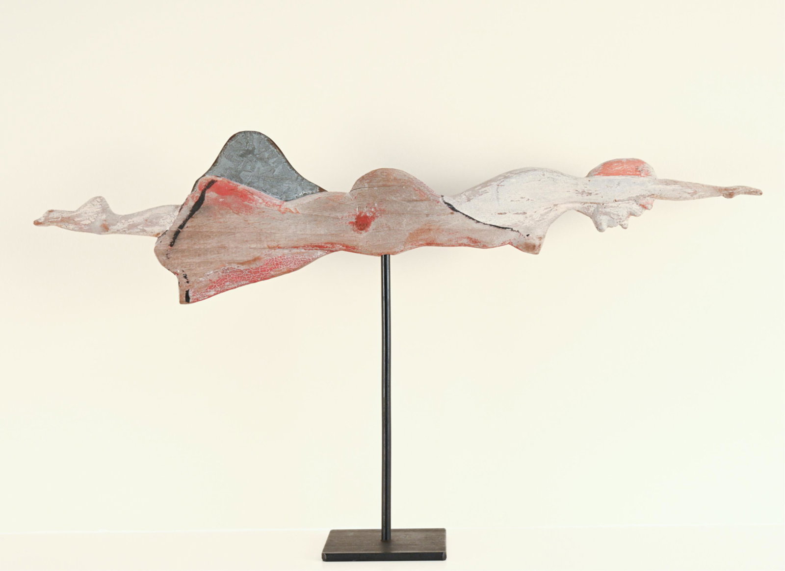 EARLY 20TH C. FOLK ART SWIMMER WEATHERVANE: Carved and painted wood. With a zinc addition. On contemporary stand. Dimensions: (Weathervane) H 6" x L 25" x D .75" Condition: Original surface with paint loss.