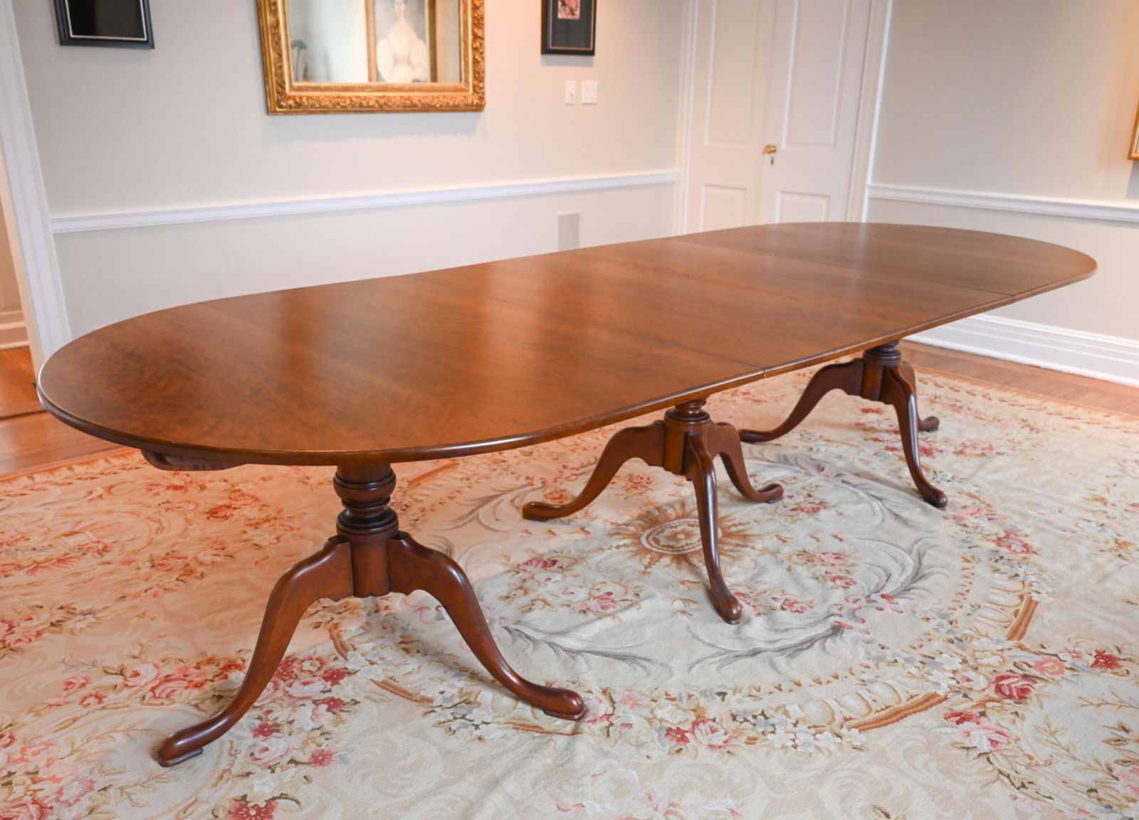 ELDRED WHEELER CHERRY PEDESTAL DINING TABLE: Two New England Queen Anne style pedestals. Stamped underneath. With one large 41.75" leaf.Dimensions: (Without leaf) H 30" x W 83" x D 48"Three sections totaling 125" in length, with tilt-top 42" cen