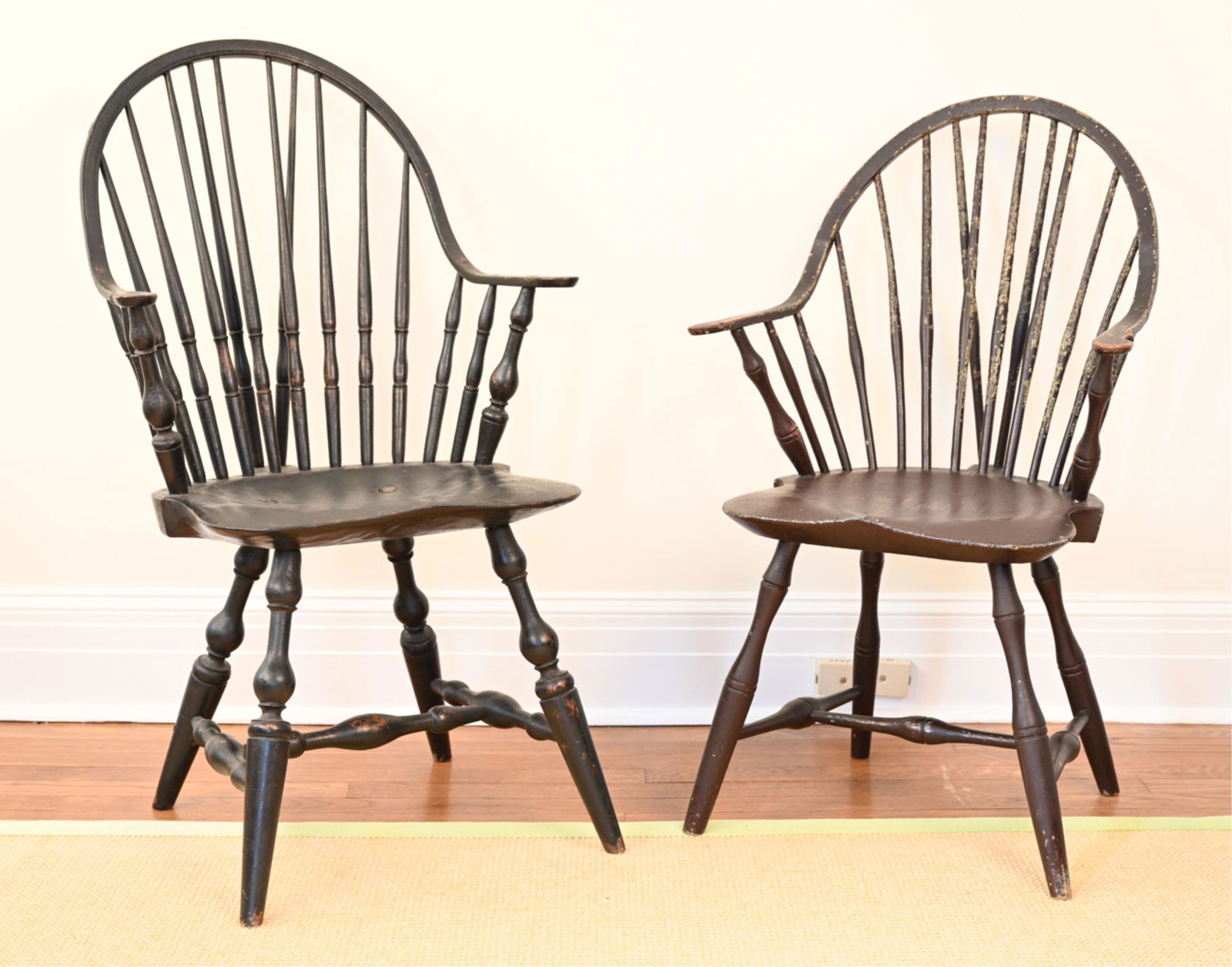 (2) CONTINUOUS-ARM WINDSOR CHAIRS, ONE 18TH C. CT: Antique 18th century Connecticut Windsor chair by E.B. Tracy of Lisbon, with brace back and saddle seat, painted deep brown, marked underneath. Second chair is a contemporary reproduction by R. Grell,