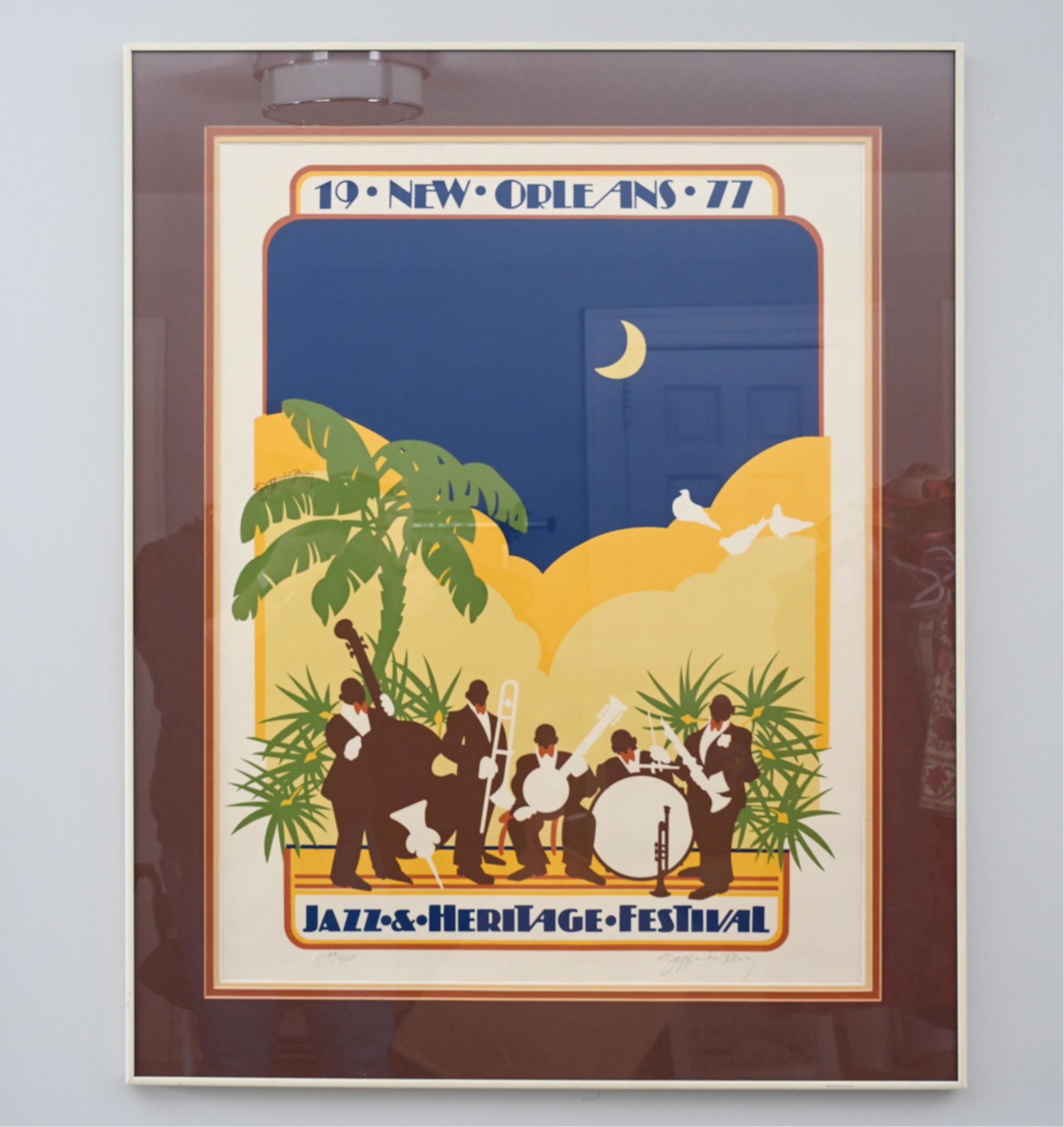 1977 NEW ORLEANS JAZZ FESTIVAL POSTER LTD. ED.: Limited edition. Signed by the artist, K. Joffrion Perry. Rare signed copy of the image. Numbered 79/500 lower left. Print appears to be signed in pen on one of the palm leaves.Dimensions: (Frame) H 3
