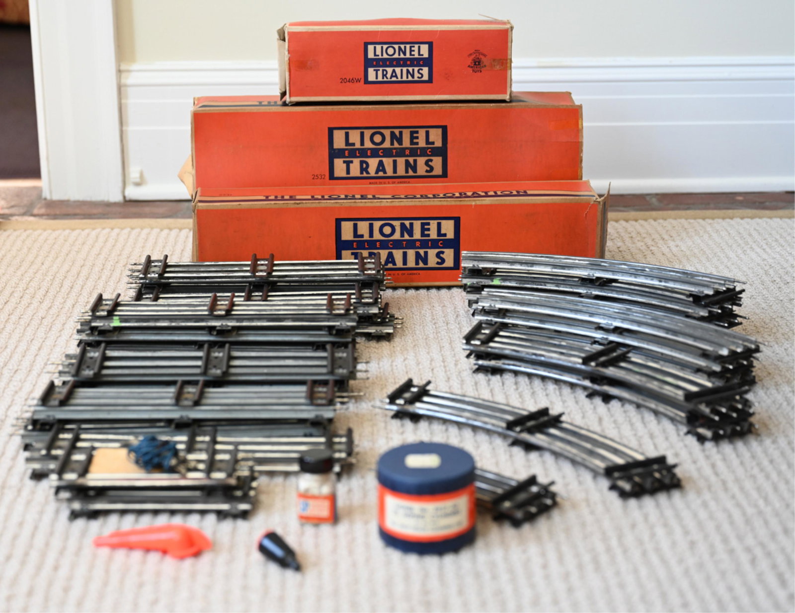 COLLECTION OF LIONEL "O" SCALE TRAINS, C. 1950'S: Collection of (4) Lionel train cars, with train tracks, period boxes, and manuals; including Model No. 2321 Engine, No. 646-12 Diesel Engine & Coal Car, and No. 2532 Silver Dawn Dining Car. Dimensions