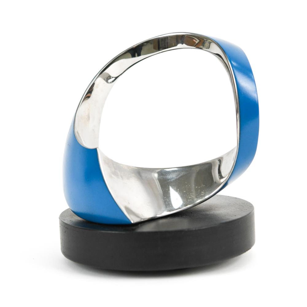 TODD REUBEN (B 1956) CHROME ENAMEL SCULPTURE: Todd Reuben, American (b. 1956) contemporary abstract enameled chrome sculputre on a rotating base, signed, dated 7.30.95, and titled "Sculpture 45" on base. Dimensions: H 9" x D 9" Condition: Minor w