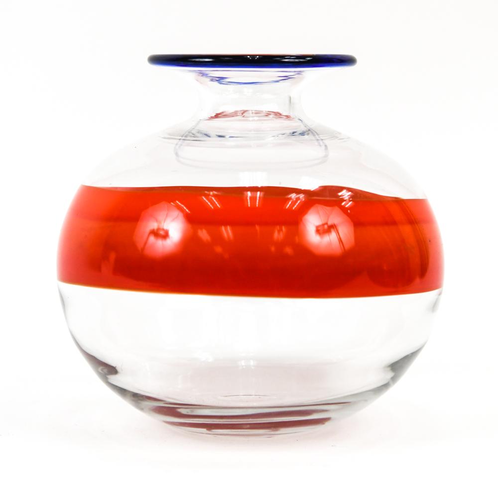ULRICA HYDMAN VALLIEN FOR KOSTA BODA VASE, 1980S: Ulrica Hydman Vallien, Swedish (1932-2018). Minimalist bulbous art glass vase by Ulrica Hydman Vallien for Kosta Boda c. 1980s/90s, with bold red-orange stripe and contrasting cobalt edge wrap. Signed