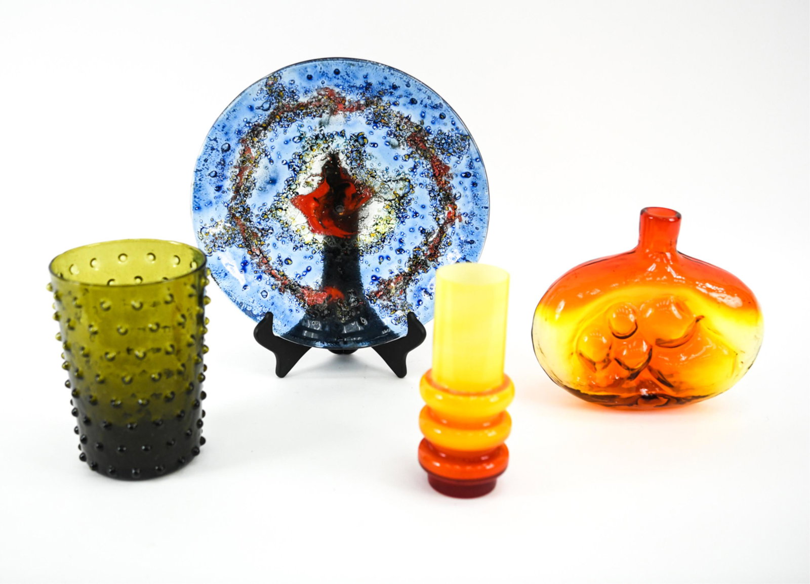 (4) MID-CENTURY ART GLASS, INCL. BLENKO: Grouping of (4) colorful art glass vessels, including: Blenko No. 6310 abstract decanter bottle in Tangerine, c. 1964; Empoli olive green hobnail bubble vase with "Made in Italy" label on bottom; abst