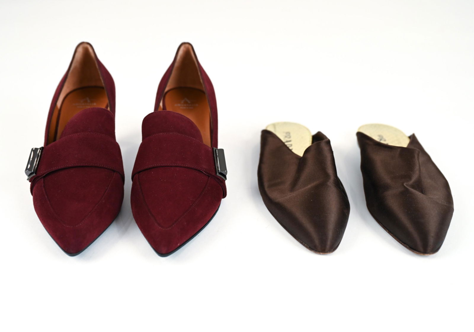 (2) PAIRS OF DESIGNER SHOES AQUATALIA & PRADA: Including Prada chocolate brown silk satin slip-on mules, size EUR 40, and Aquatalia Annette waterproof burgundy suede heeled loafers with gun metal buckle, size 9. Condition: Aquatalia unworn, new in