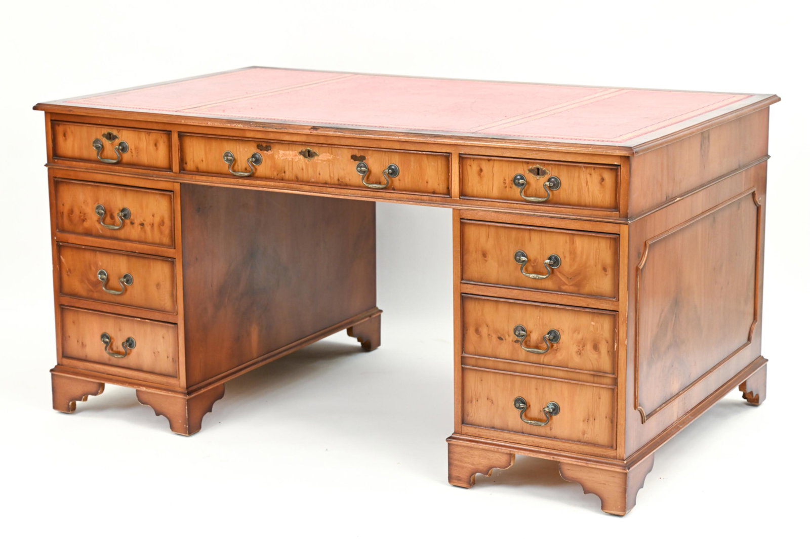 GEORGIAN STYLE KNEE HOLE DESK: Generous proportions with tooled red leather top with burl veneer. Dimensions: H 30" x W 60" x D 36" Condition: Some rubbing and scratches to wood surface and leather