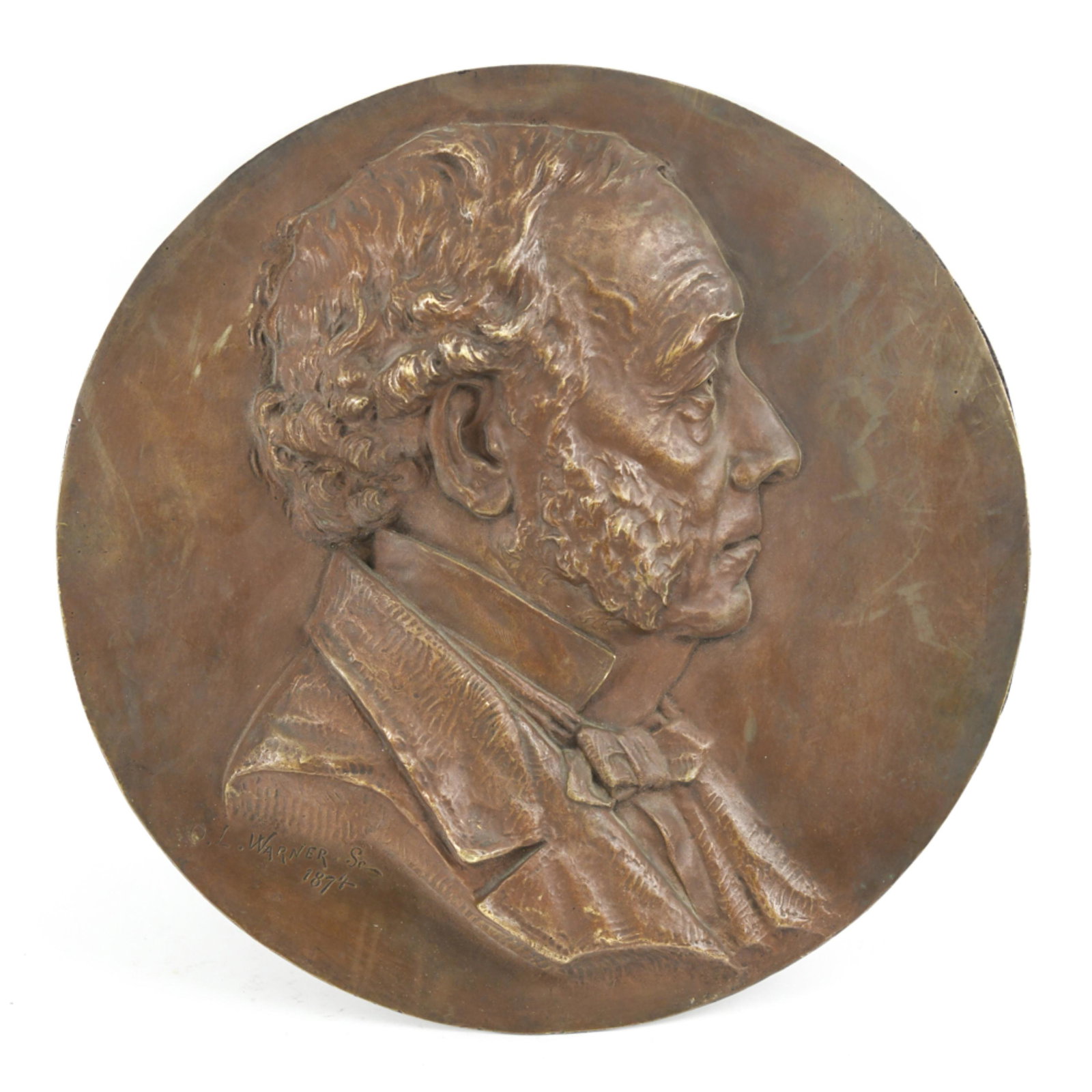 OLIN LEVY WARNER (1844-1896) BRONZE PLAQUE: Circular portrait sculpture of a distinguished gentleman. Signed and dated 1874. Dimensions: Dia. 16.25" Condition: Thin patination, rubbed at high points and edges.