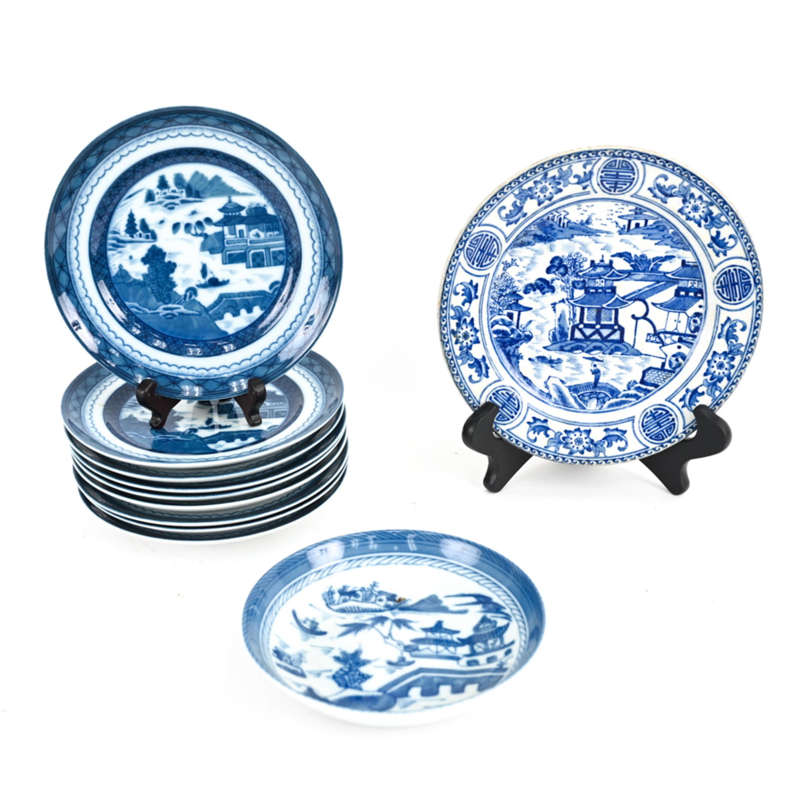 REPRODUCTION CHINESE BLUE AND WHITE PORCELAIN: Plates including some made in Portugal and one in England. Dimensions: Largest: Dia: 8" Condition: Showing only minor signs of light use and handling.