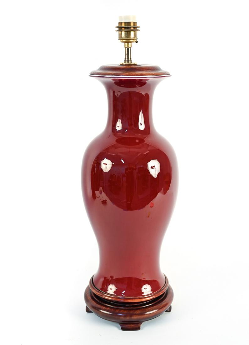 CHINESE PORCELAIN SANG DE BOEUF VASE LAMP: Dimensions: (Top of socket) H 25" Condition: Untested. Wear consistent with use including a few small scratches.