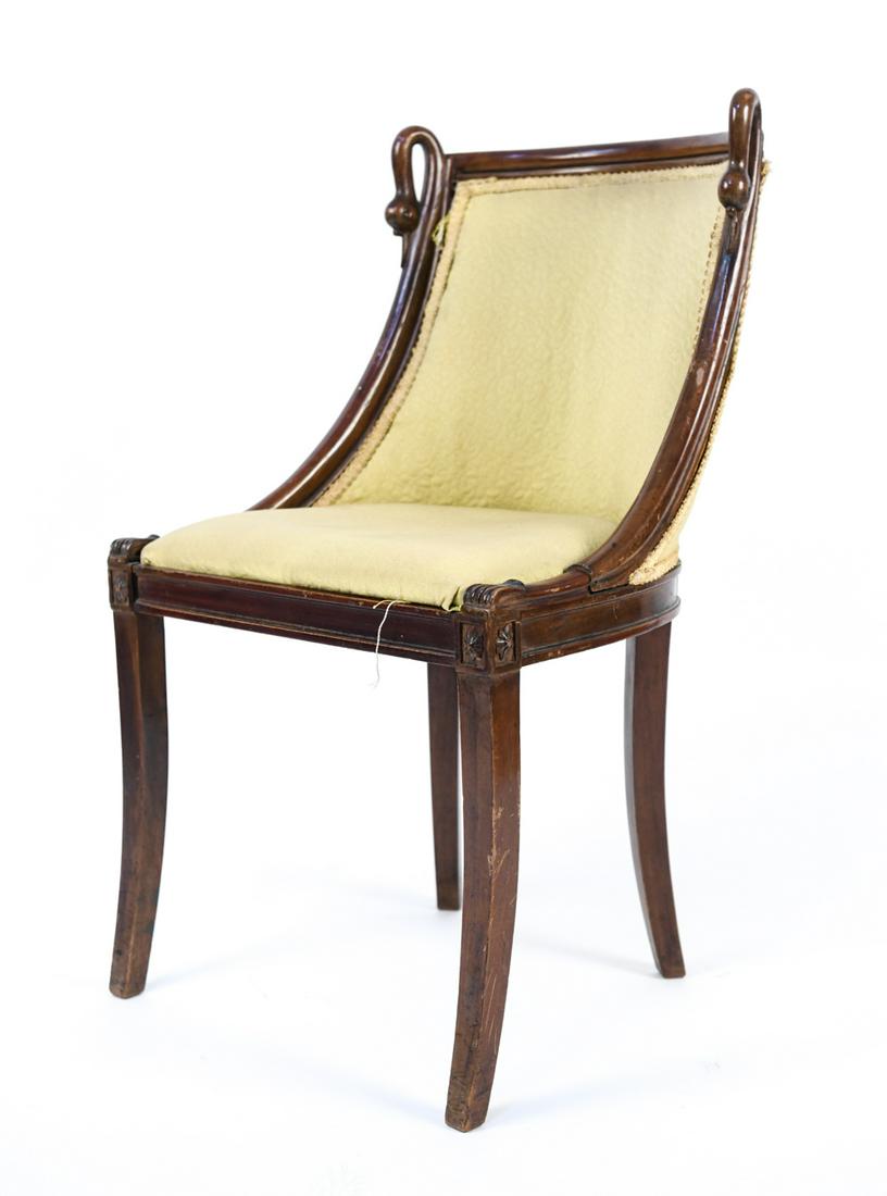 EMPIRE STYLE SIDE CHAIR: With carved rosettes and swan head detail. Removable seat cushion. Dimensions: H 33" x W 19" x D 16" x SH 17.5" Condition: One back leg loose. Soiling to upholstery and loose trim; in need of reuphols