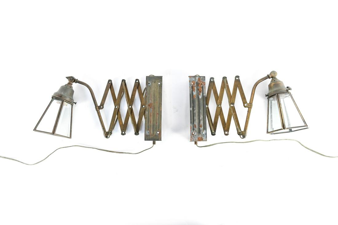 PAIR OF BRASS TONE AND GLASS EXTENDING SCONCES: Dimensions: (Folded) H 17" x W 5" x D 4.5" Condition: Patina and oxidation to metal elements. Surface scratches to glass shades. One in need of re wiring with base loose from shade.