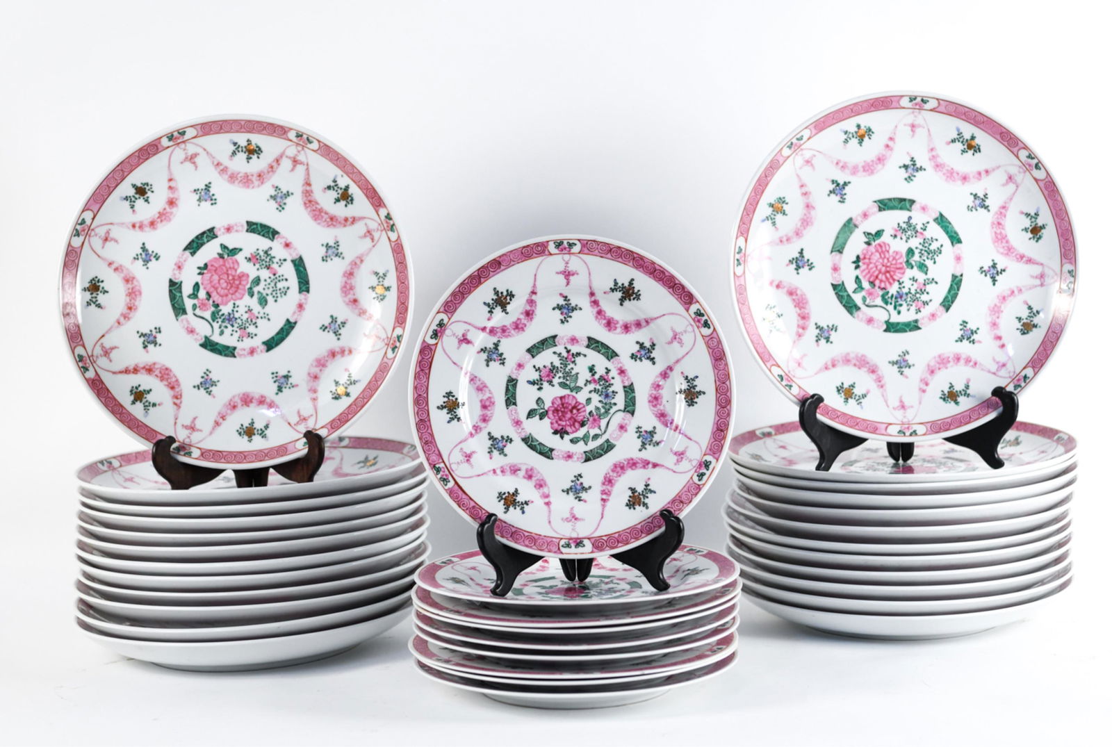 (33) A.C.F JAPANESE PORCELAIN PLATES: Decorated in Hong Kong. Labeled underneath. Dimensions: (24) H 1.5" x Dia. 12", (9) H 1.5" x Dia. 12" Condition: Showing signs of light wear including surface stains and flea bites to edges.