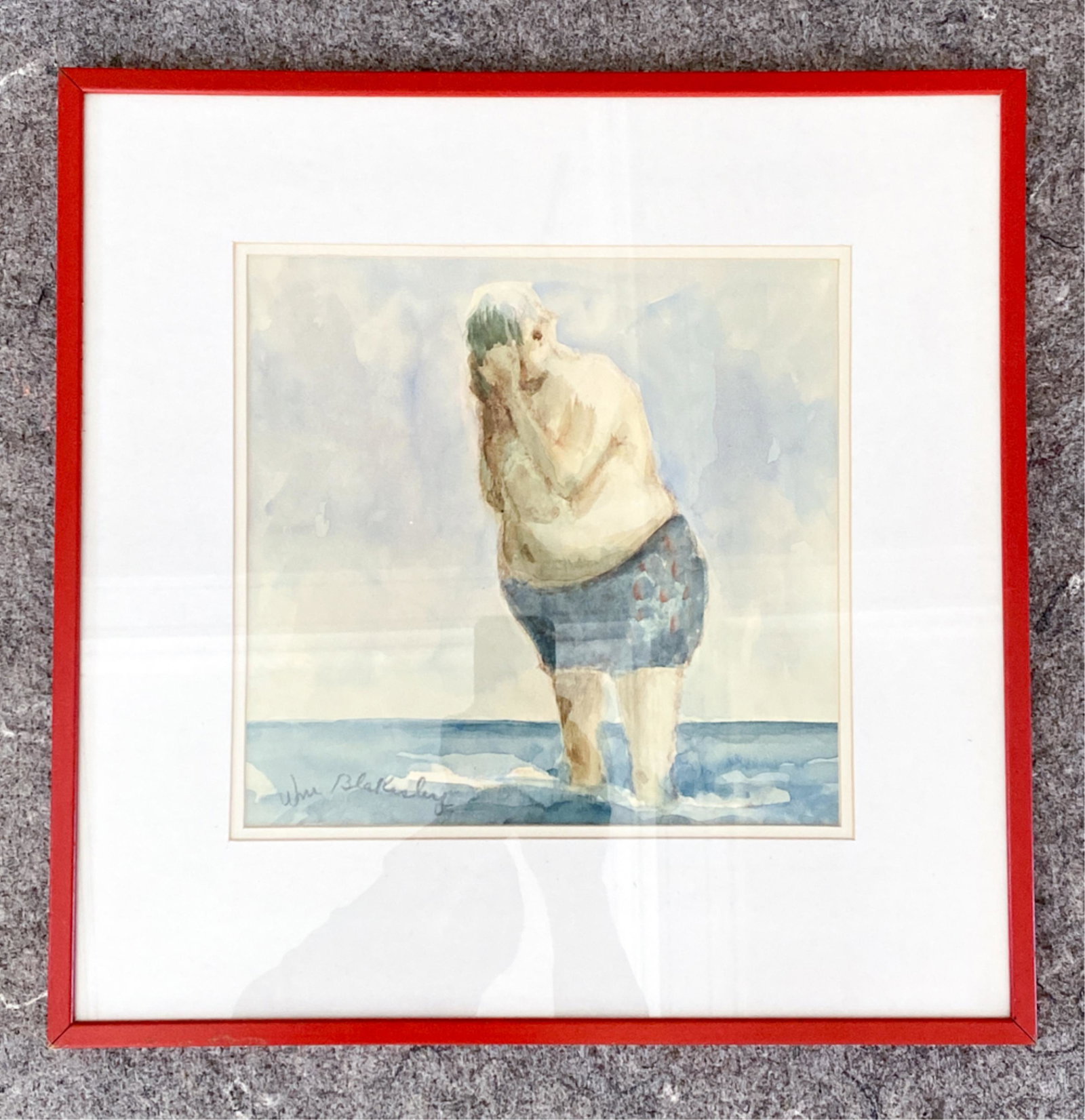 WILLIAM BLAKESLEY (1921-2012) WATERCOLOR: Signed Wm Blakesley lower left. Watercolor of man standing in sea. Dimensions: (Frame) H 18.75" x W 18.75", (Sight) H 11" x W 11.25" Condition: Few small rubs to frame.